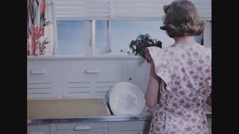 Housewife Sorting Dishes In The Kitchen Stock Footage 93659689