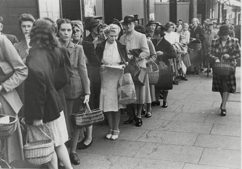 Housewives Queue At A Shop. Stock Photos