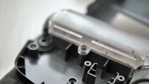 Housework and technology concept. Maintenance and service of robot vacuum Stock Footage 224144097