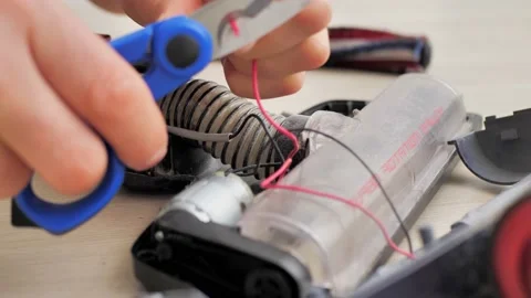 Housework and technology concept. Maintenance and service of robot vacuum Video stock 226226407