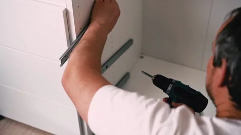 Housework, father fixing a broken shelf. Distribution of duties Stock Footage 221814044