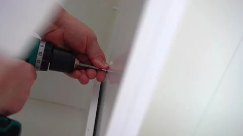 Housework, father fixing a broken shelf. Distribution of duties Stock Footage 250956442