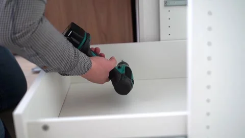 Housework, father fixing a broken shelf. Distribution of duties Stock Footage 250956556