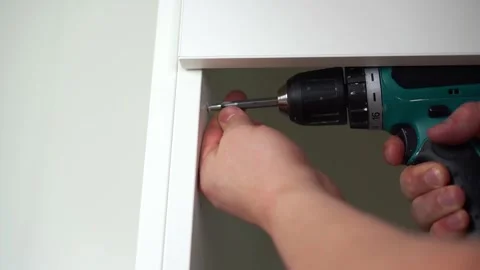 Housework, father fixing a broken shelf. Distribution of duties Stock Footage 251859296
