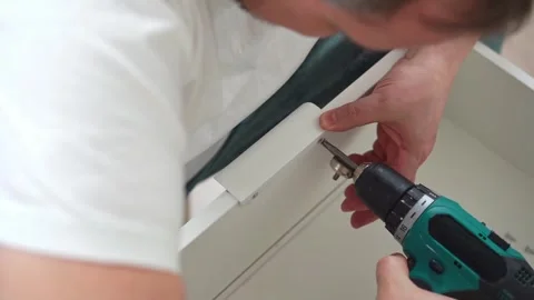 Housework, father fixing a broken shelf. Distribution of duties Stock Footage 258553852