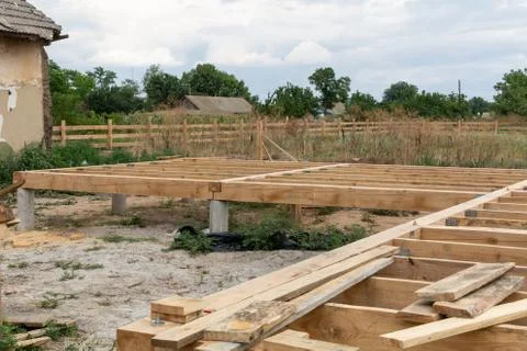 Housing frame assembly. Installation of residential building base of a-type f Stock Photos