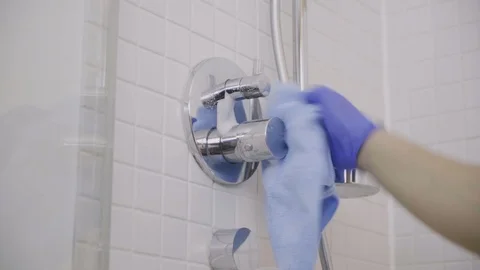 Houskeeper cleaning shower Stock Footage 91031138