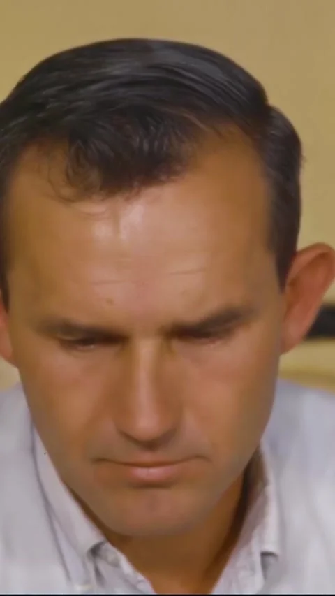 HOUSTON - 1966 - A NASA technician test eats a piece of space food. Stock Footage 342802534
