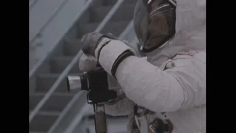 HOUSTON - 1969 - Astronauts practice and film lunar specimen collection during Stock Footage 322970679