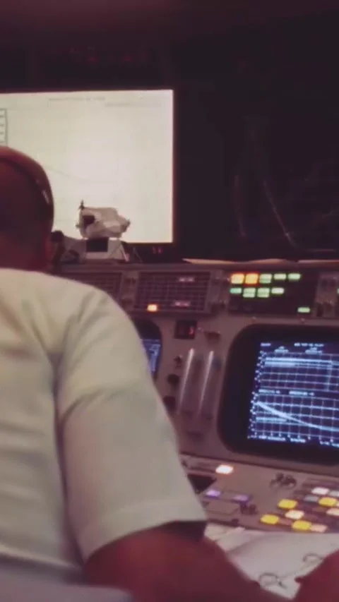 HOUSTON - 1969 - Men use computers in NASA's Mission Operation Control Rooms to Stock Footage 342901646