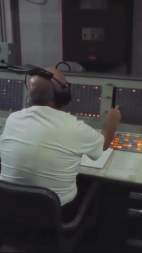 HOUSTON - 1970 - A man operates a communication line switchboard at mcc. Stock Footage 342912469