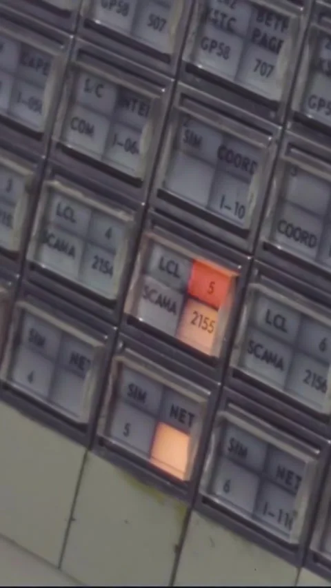 HOUSTON - 1970 - A man pushes buttons on a communication line switchboard at Stock Footage 342910356