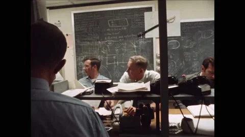 HOUSTON - 1970 - NASA technicians use headsets and monitors in a Mission Support Stock Footage 313053582