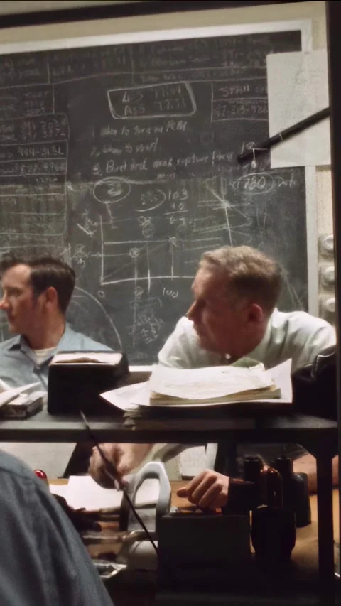 HOUSTON - 1970 - NASA technicians use headsets and monitors in a Mission Support Stock Footage 340301271