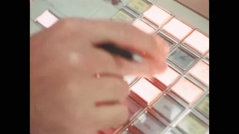 HOUSTON - 1971 - A control engineer pushes buttons in NASA's Mission Operations Video stock 313053321