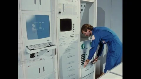 HOUSTON - 1990 - An astronaut working at a computer station. Surgeons working Stock Footage 325210337