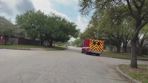 Houston Fire EMS ambulance responding to an emergency at a residence in Stock Footage 334488936