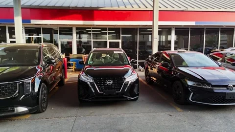 Houston, Texas, US - 04.02.2026: A front-facing view of three cars parked in a 스톡 동영상 337825253