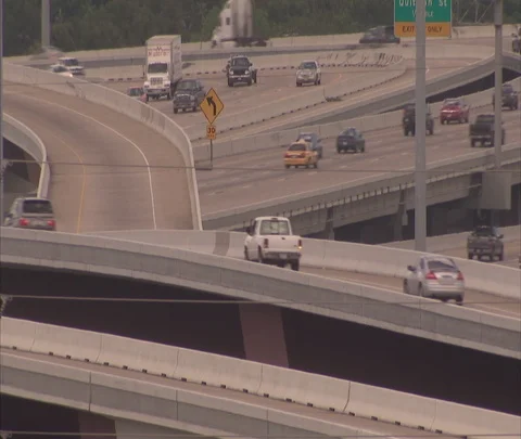 Houston, TX; MS traffic moving on criss cross tangle of highway ramps Stock Footage 86697872