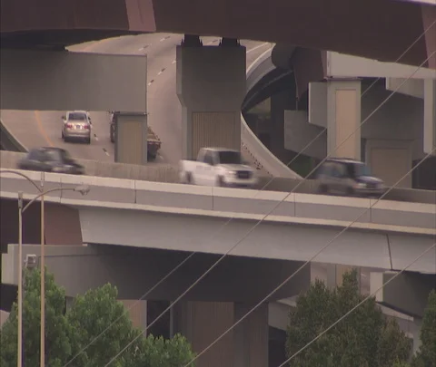Houston, TX; MS traffic moving on two tiers of highway ramps Stock Footage 86697897