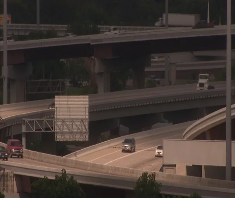 Houston, TX; Traffic on multiple tiers of highway ramps Stock Footage 86697808