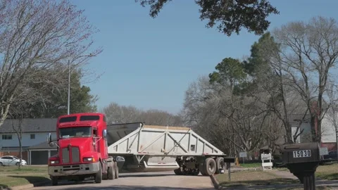 Houston, TX, US - March 01, 2022: 18 wheelers entering exiting construction site Stock-Footage 171196490