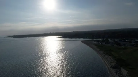 Hover Above Ocean and Beach During Summer Sunset. Aerial, 4K Stock Footage 94748723