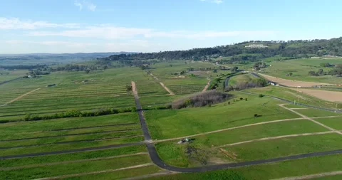 Hover around Mt Panorama in Bathurst city of Australia – farms, fields as 4k. Stock Footage 141398457