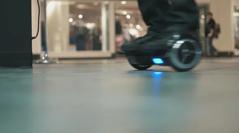 Hoverboard with Blue LED Lights Spinning and Rolling Around. Stock Footage 58305117