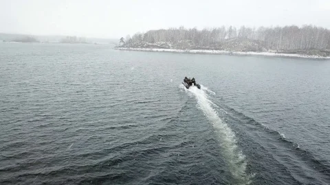 Hovercraft Approaching to a Snowy Island Stock Footage 95771524