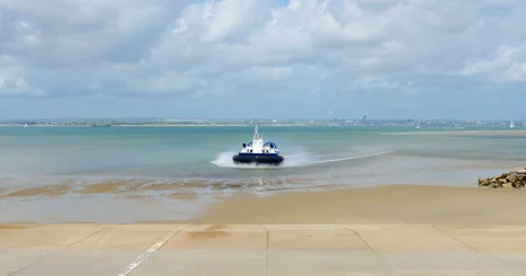 Hovercraft boat arriving on the beach Stock Footage 64947472