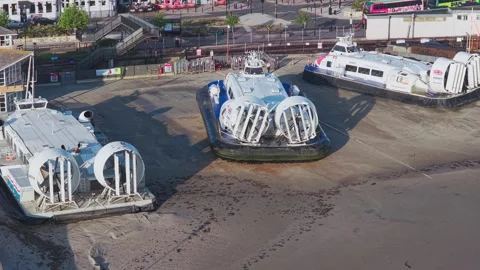 Hovercraft departing terminal at Ryde on summer morning Stock Footage 336240621