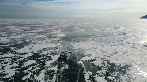 Hovercraft drifting over smooth ice. Slow-motion epic cinematic drone footage Stock Footage 220004446