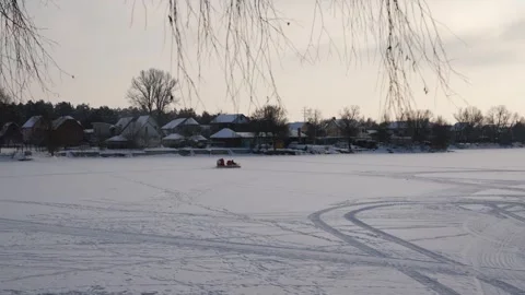 Hovercraft driving at high speed on snow covered frozen ice surface of lake Stock Footage 326774804