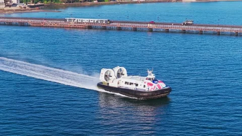 Hovercraft leaving Ryde seafront with train on Ryde Pier, Isle of Wight Stock Footage 336206219