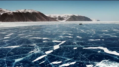 Hovercraft rides on blue ice of Baikal lake in winter. Stock Footage 219964924