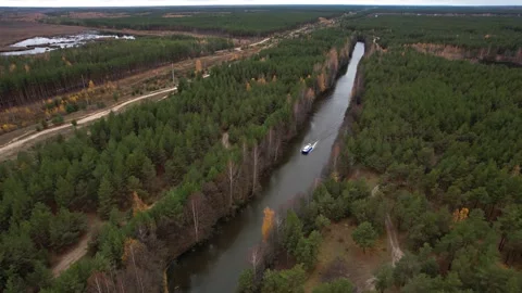 A hovercraft rides through a narrow channel.View from the height.A rescue boat i Stock Footage 164157501