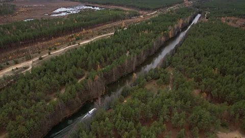 A hovercraft rides through a narrow channel.View from the height.A rescue boat i Stock Footage 164157522