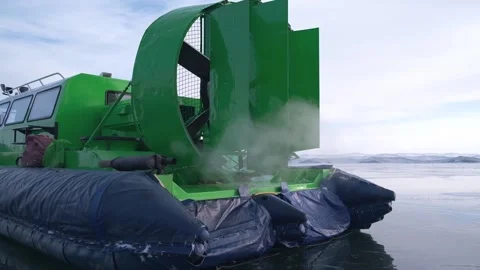 Hovercraft with running engine ice of lake in winter. safe amphibious transport. Stock Footage 230463353
