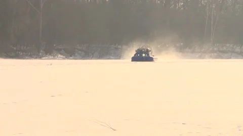 An hovercraft vehicle is driving through the snow Stock Footage 86078563
