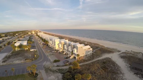 Hovering and rotating CW to reveal the sunset and lighthouse. Stock Footage 90561464