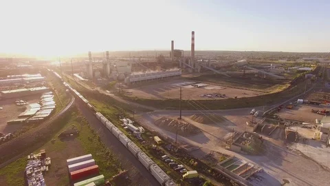 Hovering back away from train away from industrial Color Corrected Stock Footage 98845161