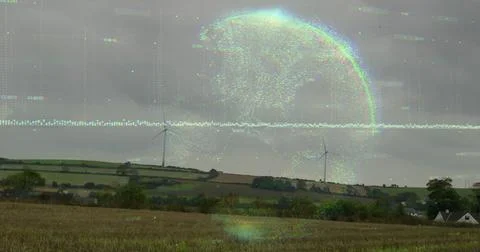 Hovering digital globe overlaying streaming code lines over harvested farmland, Foto stock