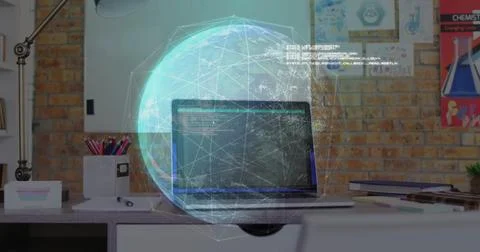 Hovering digital holographic globe floating over desk in office, with laptop 写真素材