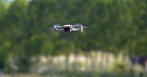 Hovering dji drone in field Stock Footage 196911292