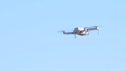 A hovering drone against a pale sky in daylight Stock-Footage 309705079
