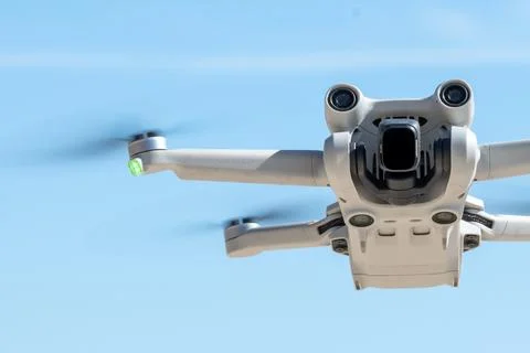 Hovering Drone in Clear Blue Sky Stock Photos