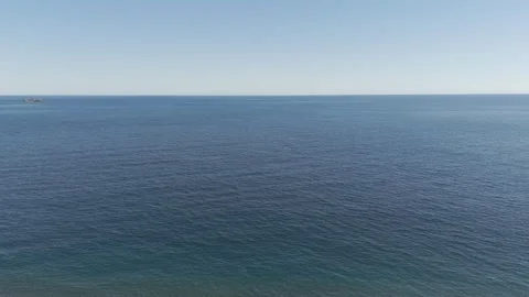 Hovering Drone Orbit Over Wide Sandy Beach and Calm Sea Stock Footage 326179700