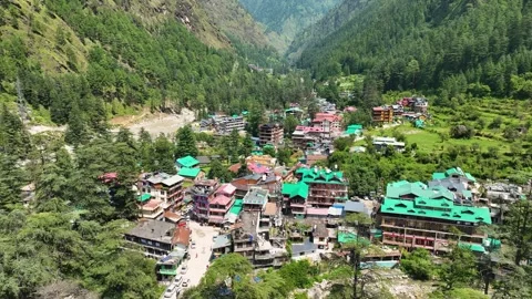 Hovering drone shot looking down at Kasol trekking basecamp Stock-Footage 345274521