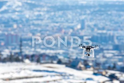 Hovering drone that takes pictures Stock Photos